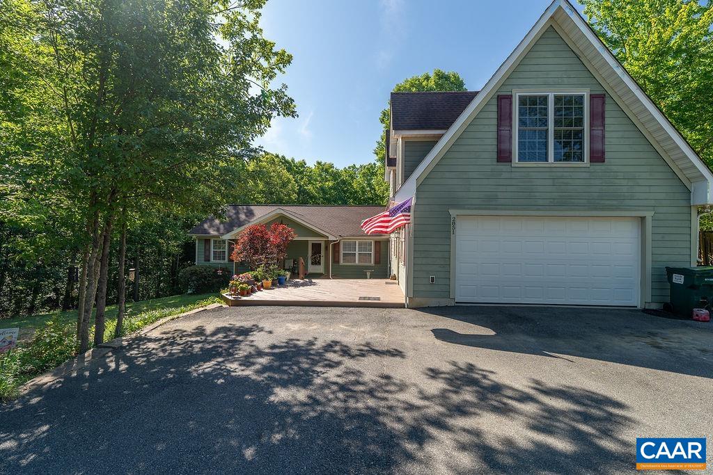 2851 Martin Kings Road Scottsville, VA 24590 - Photo 15 of 67 a front view of a house with a yard and garage