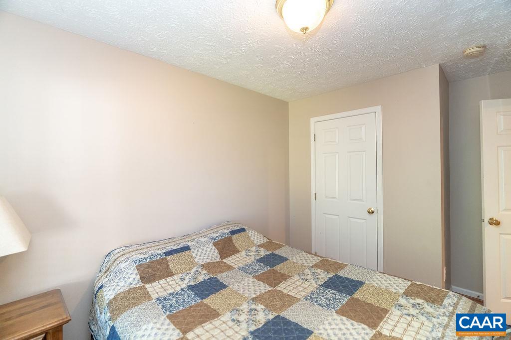2851 Martin Kings Road Scottsville, VA 24590 - Photo 18 of 67 a bedroom with a bed and a dresser