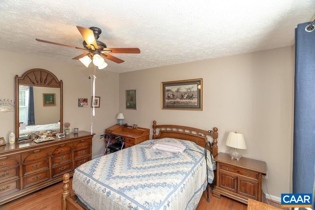 2851 Martin Kings Road Scottsville, VA 24590 - Photo 20 of 67 a bedroom with a bed and wooden floor