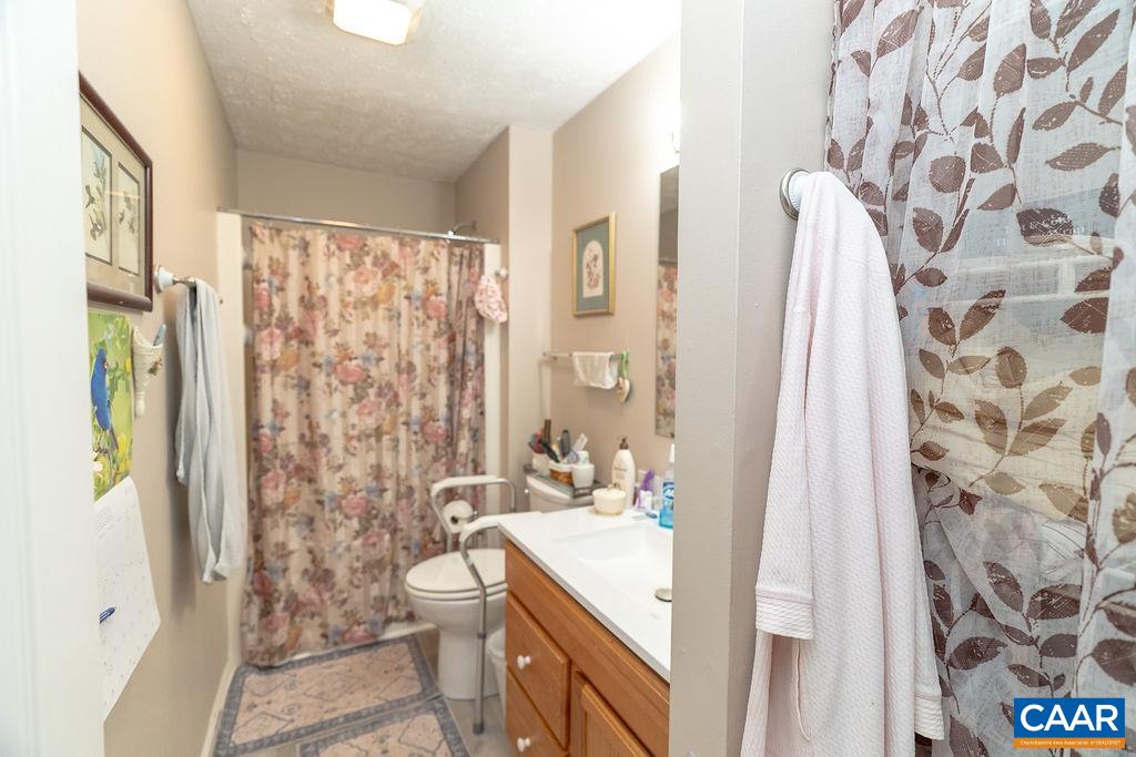 2851 Martin Kings Road Scottsville, VA 24590 - Photo 22 of 67 a bathroom with a sink toilet and shower