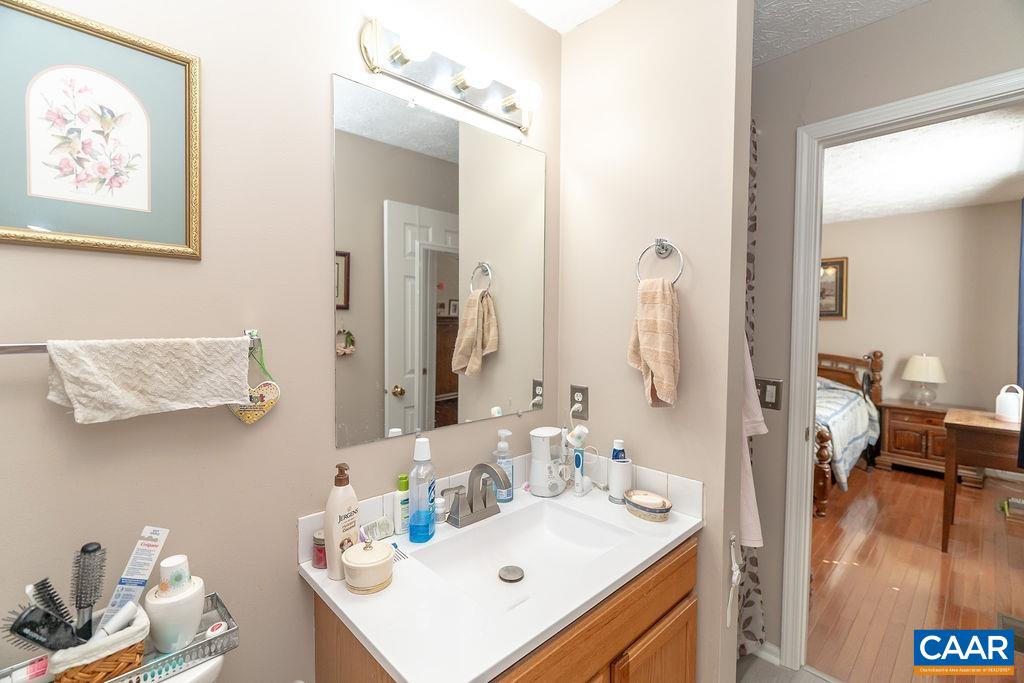 2851 Martin Kings Road Scottsville, VA 24590 - Photo 23 of 67 a bathroom with a sink vanity and mirror