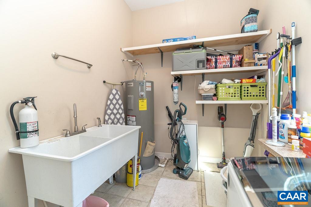 2851 Martin Kings Road Scottsville, VA 24590 - Photo 34 of 67 a bathroom with a sink a mirror and shower