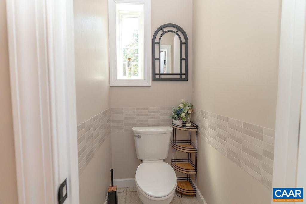 2851 Martin Kings Road Scottsville, VA 24590 - Photo 43 of 67 a white toilet sitting next to a bathroom sink