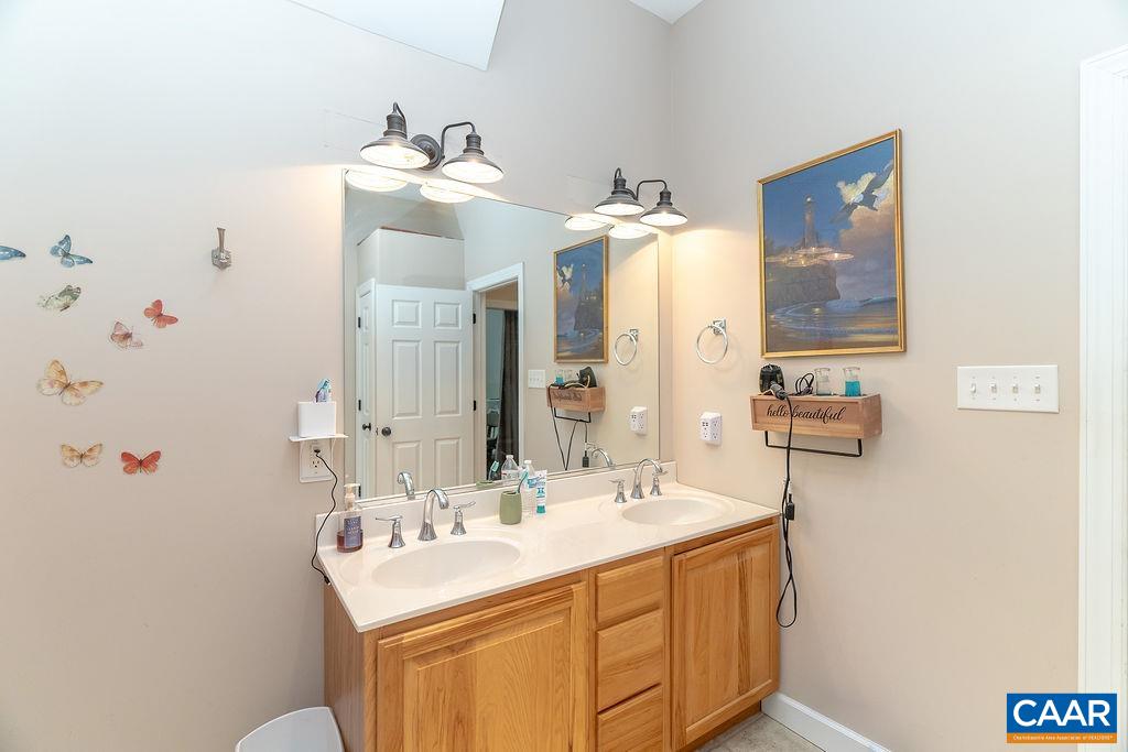 2851 Martin Kings Road Scottsville, VA 24590 - Photo 44 of 67 a bathroom with a sink and a mirror