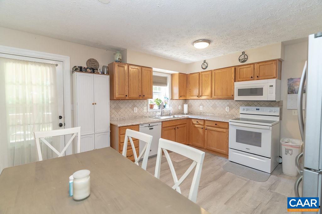 2851 Martin Kings Road Scottsville, VA 24590 - Photo 49 of 67 a kitchen with a sink cabinets and window