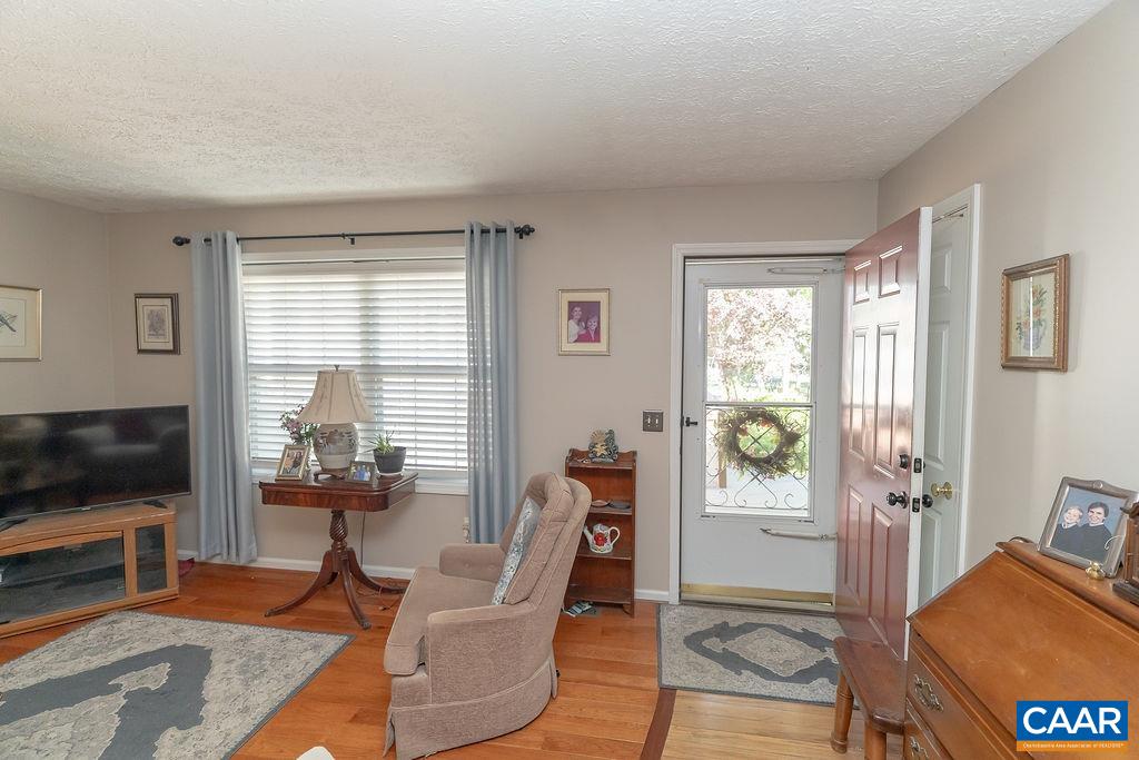 2851 Martin Kings Road Scottsville, VA 24590 - Photo 50 of 67 a living room with furniture a flat screen tv and a window
