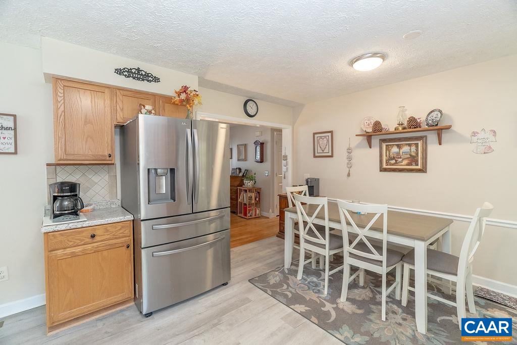 2851 Martin Kings Road Scottsville, VA 24590 - Photo 56 of 67 a kitchen with stainless steel appliances granite countertop a refrigerator and microwave