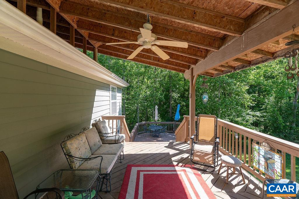 2851 Martin Kings Road Scottsville, VA 24590 - Photo 58 of 67 a view of balcony with wooden floor and outdoor seating