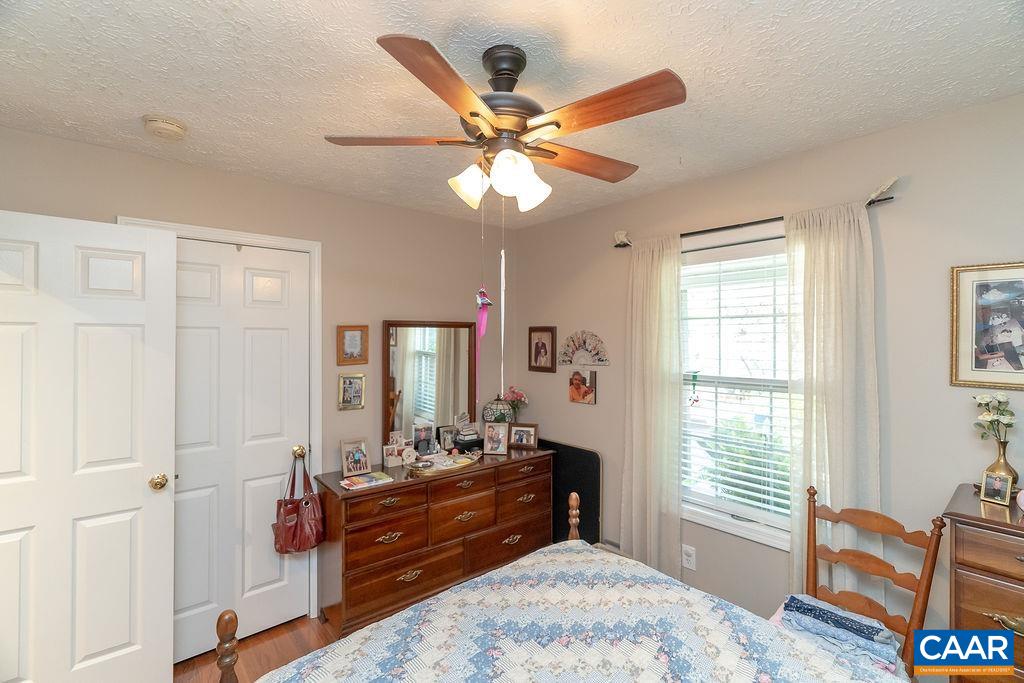 2851 Martin Kings Road Scottsville, VA 24590 - Photo 8 of 67 a bedroom with a bed and a chandelier