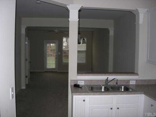 8453 Central Drive Raleigh, NC 27613 - Photo 3 of 8 a bathroom with a sink and a mirror