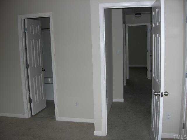 8453 Central Drive Raleigh, NC 27613 - Photo 4 of 8 a view of a bathroom from a hallway