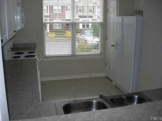 8453 Central Drive Raleigh, NC 27613 - Photo 7 of 8 a kitchen with a sink and large window