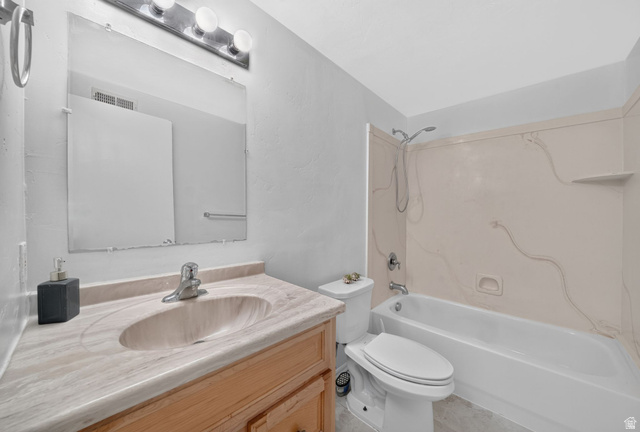 297 West Bricker Road Draper, UT 84020 - Photo 28 of 44 Bathroom vanity featuring an integrated sink, wood-finish cabinetry, and a full-width wall mirror