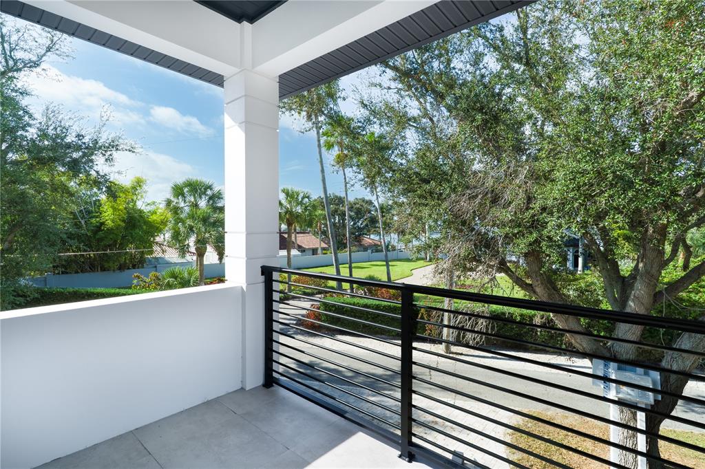 2414 Bayshore Road Nokomis, FL 34275 - Photo 19 of 64 a view of a balcony with a garden