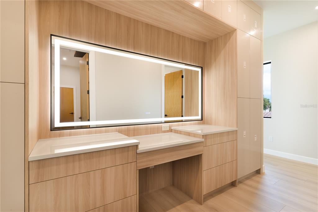 2414 Bayshore Road Nokomis, FL 34275 - Photo 21 of 64 a bathroom with a sink and a mirror