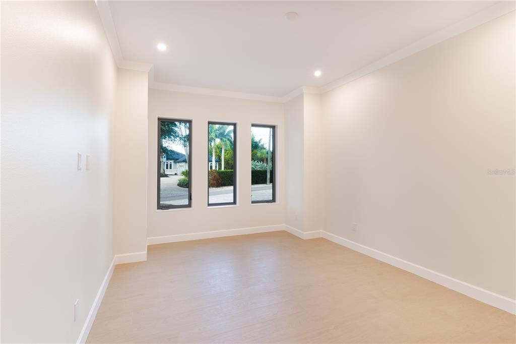 2414 Bayshore Road Nokomis, FL 34275 - Photo 29 of 64 an empty room with windows