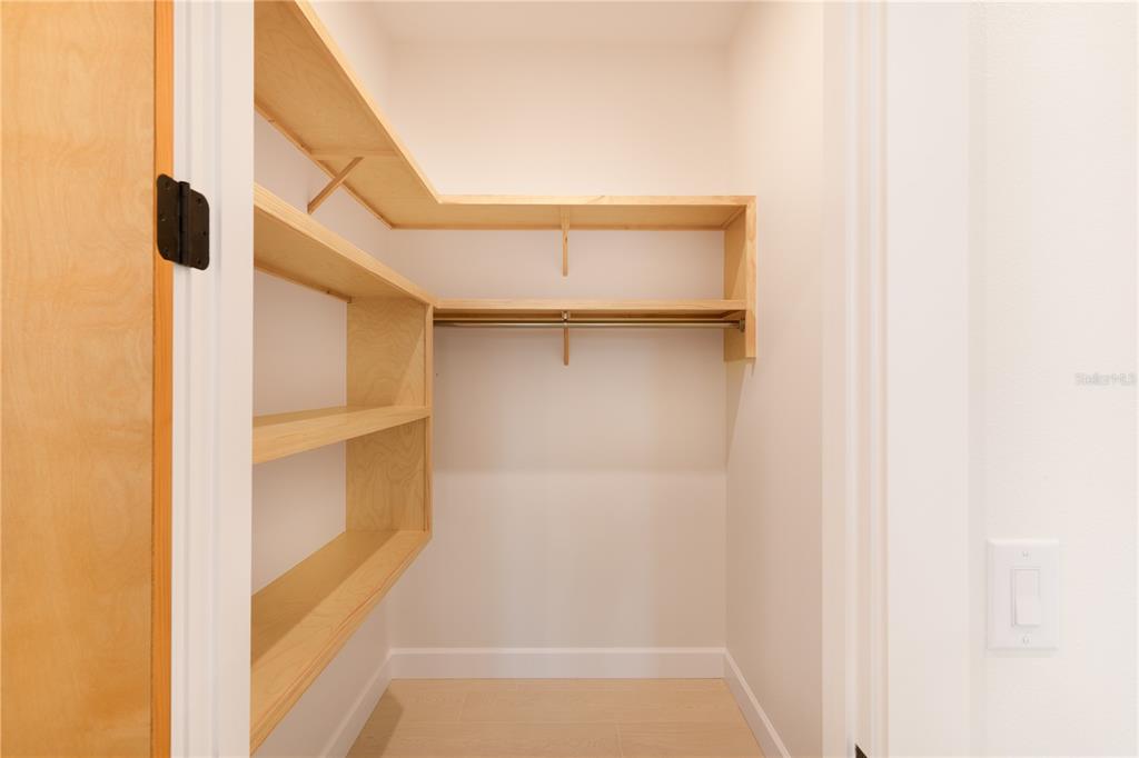 2414 Bayshore Road Nokomis, FL 34275 - Photo 31 of 64 a view of walk in closet with empty racks