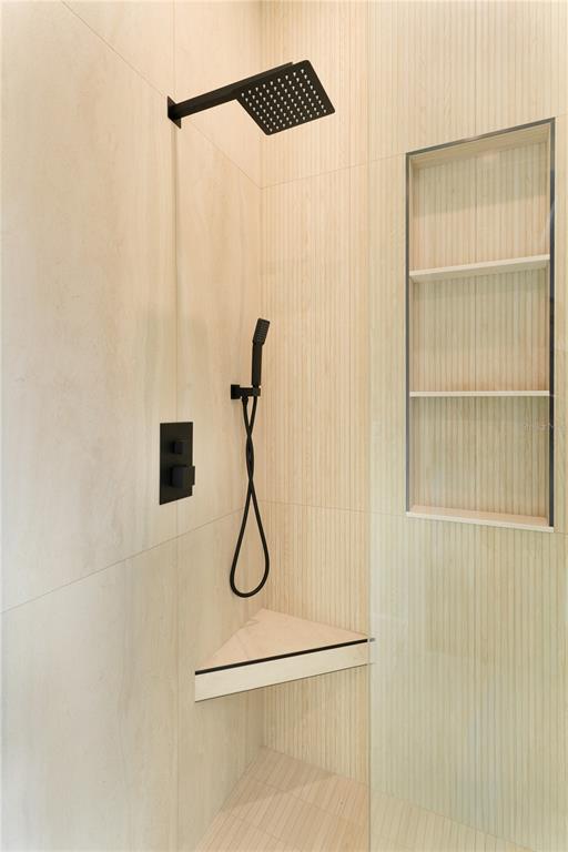 2414 Bayshore Road Nokomis, FL 34275 - Photo 33 of 64 a bathroom with a shower