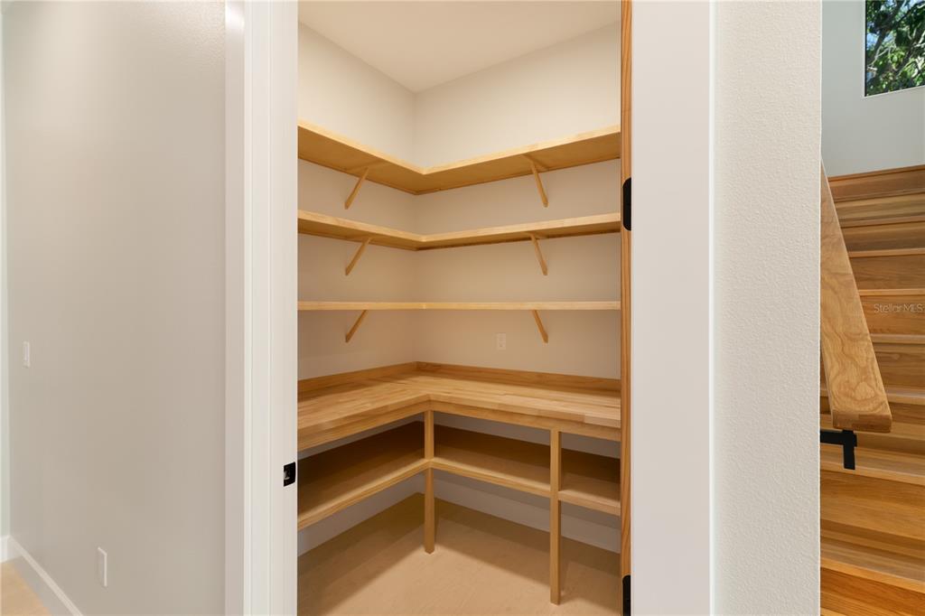 2414 Bayshore Road Nokomis, FL 34275 - Photo 41 of 64 a view of walk in closet with empty racks