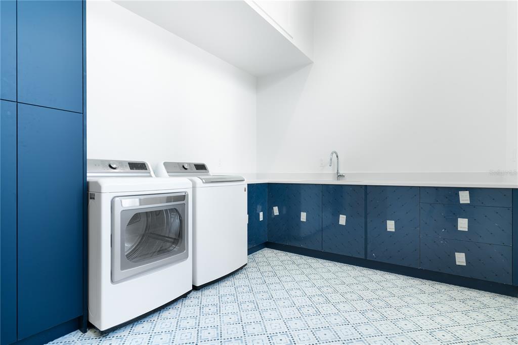 2414 Bayshore Road Nokomis, FL 34275 - Photo 45 of 64 a view of a utility room with washer and dryer