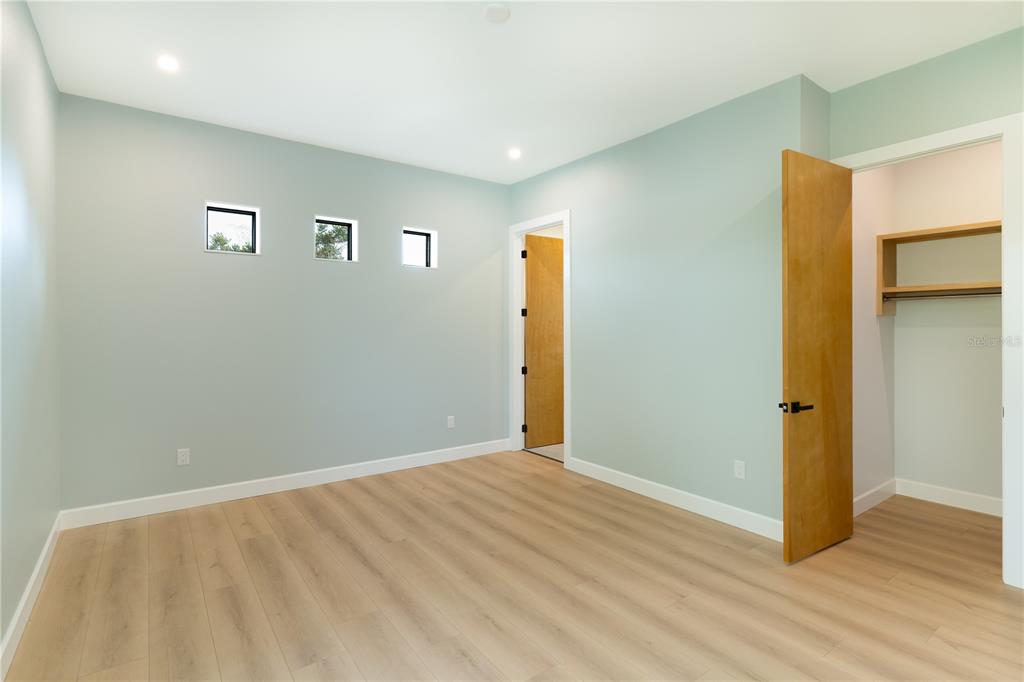 2414 Bayshore Road Nokomis, FL 34275 - Photo 54 of 64 a view of an empty room with wooden floor