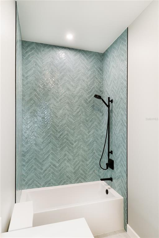 2414 Bayshore Road Nokomis, FL 34275 - Photo 58 of 64 a bathroom with a bathtub and a shower