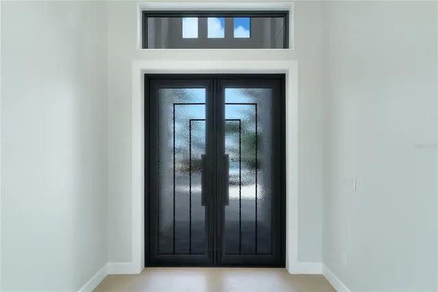 a kitchen with a stove a refrigerator and a sink
