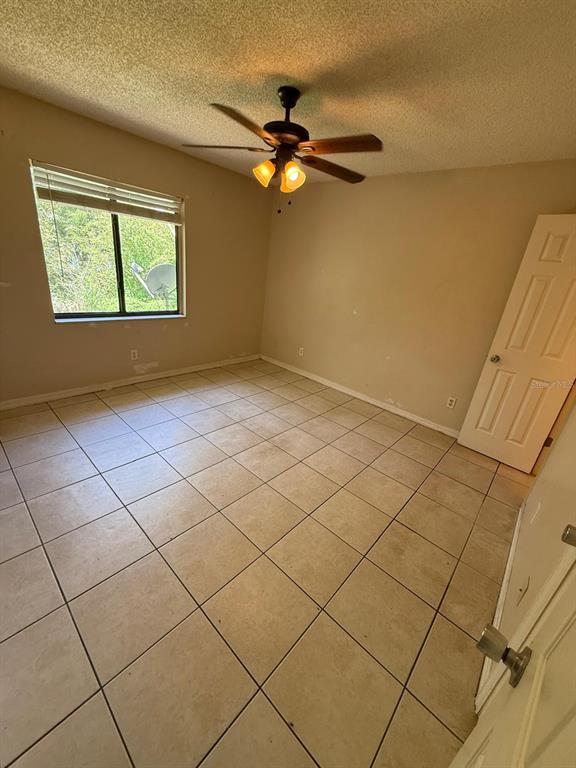 417 Century Boulevard, Unit C Auburndale, FL 33823 - Photo 3 of 5 a view of an empty room with a window