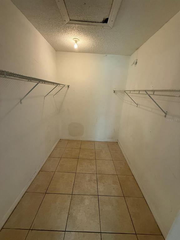 417 Century Boulevard, Unit C Auburndale, FL 33823 - Photo 4 of 5 a view of a room with an empty shelves