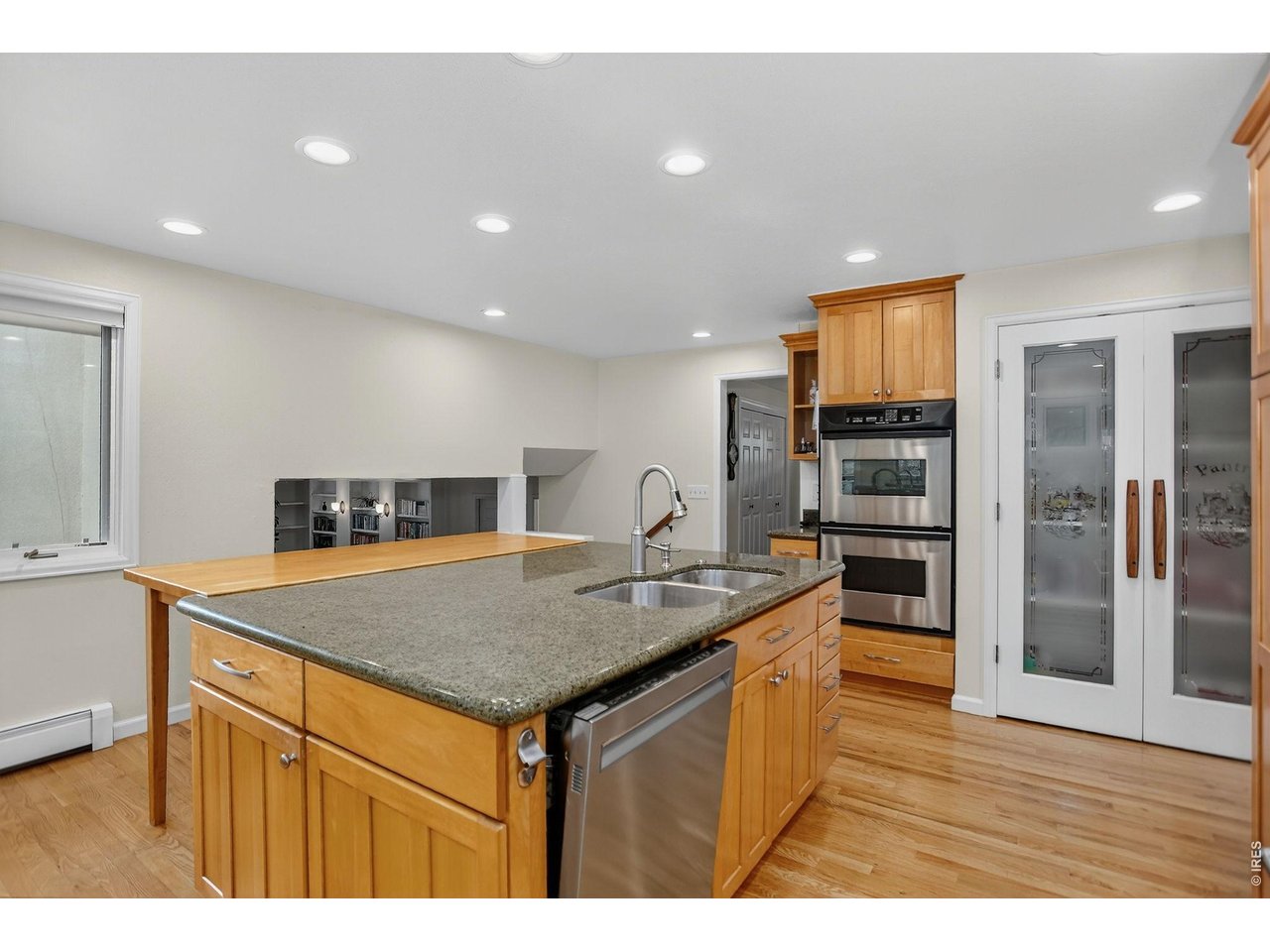 1875 Lehigh Street Boulder, CO 80305 - Photo 11 of 47 a kitchen with stainless steel appliances granite countertop a sink and a refrigerator