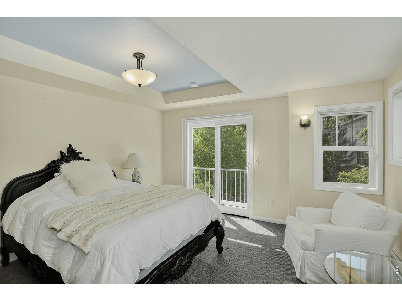 1875 Lehigh Street Boulder, CO 80305 - Photo 16 of 47 a bedroom with a large bed and a couch
