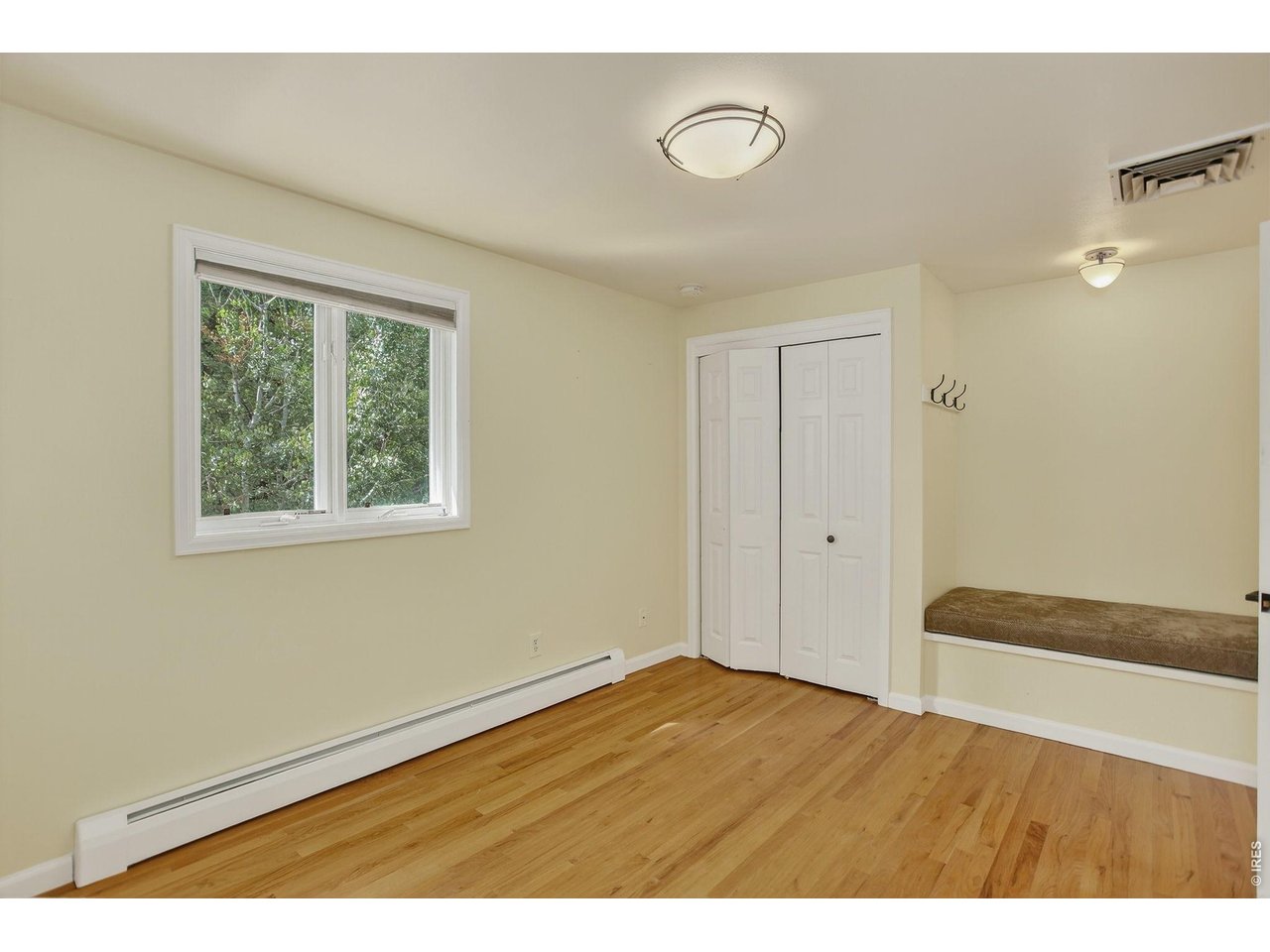 1875 Lehigh Street Boulder, CO 80305 - Photo 24 of 47 a view of an empty room with wooden floor and a window