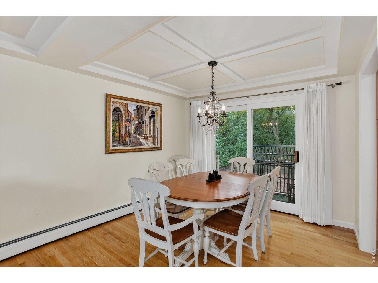1875 Lehigh Street Boulder, CO 80305 - Photo 4 of 47 a dining room with furniture a chandelier and wooden floor