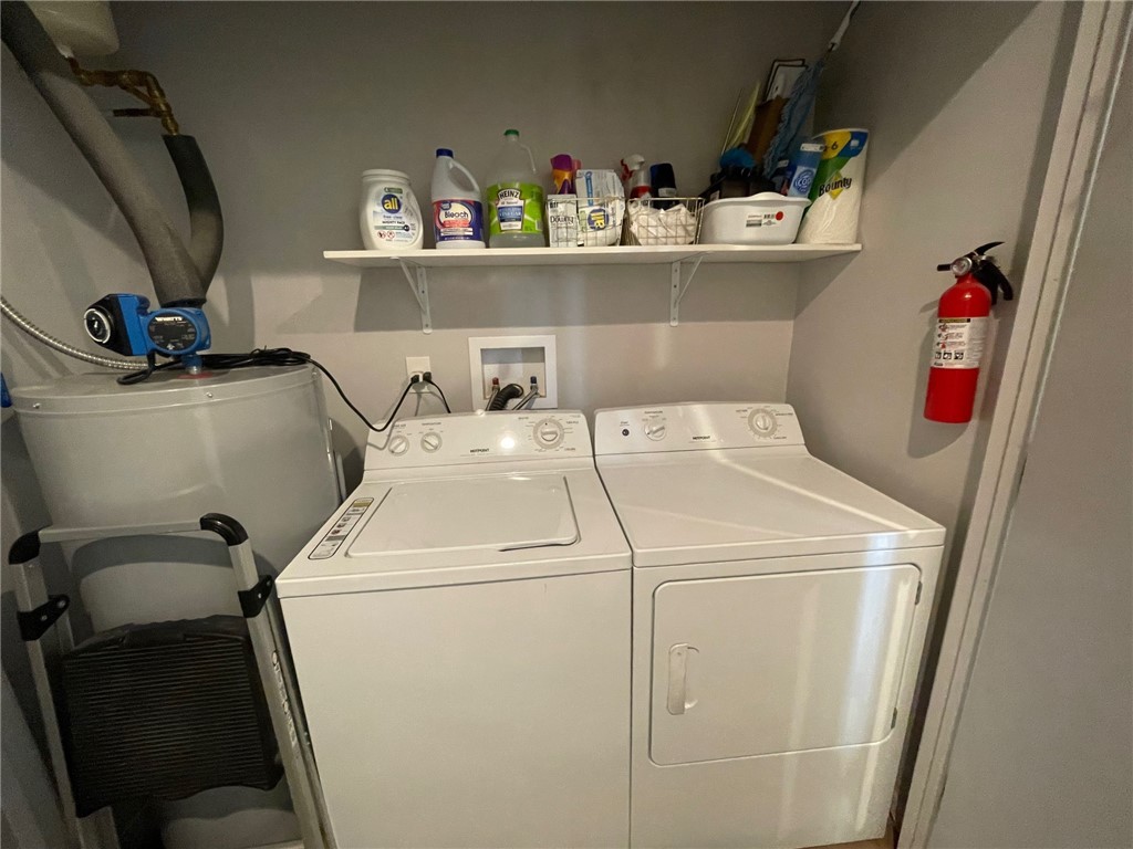 11328 Kinard Road Yucca, AZ 86438 - Photo 15 of 40 a utility room with dryer and washer