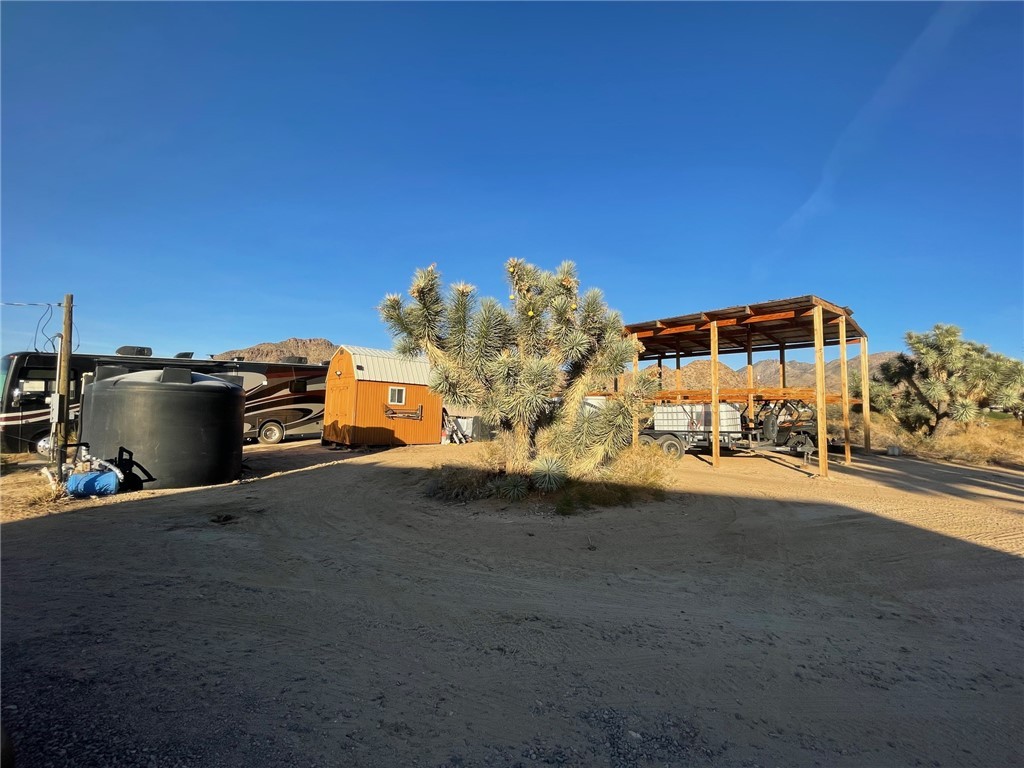 11328 Kinard Road Yucca, AZ 86438 - Photo 21 of 40 a front view of a house with a yard