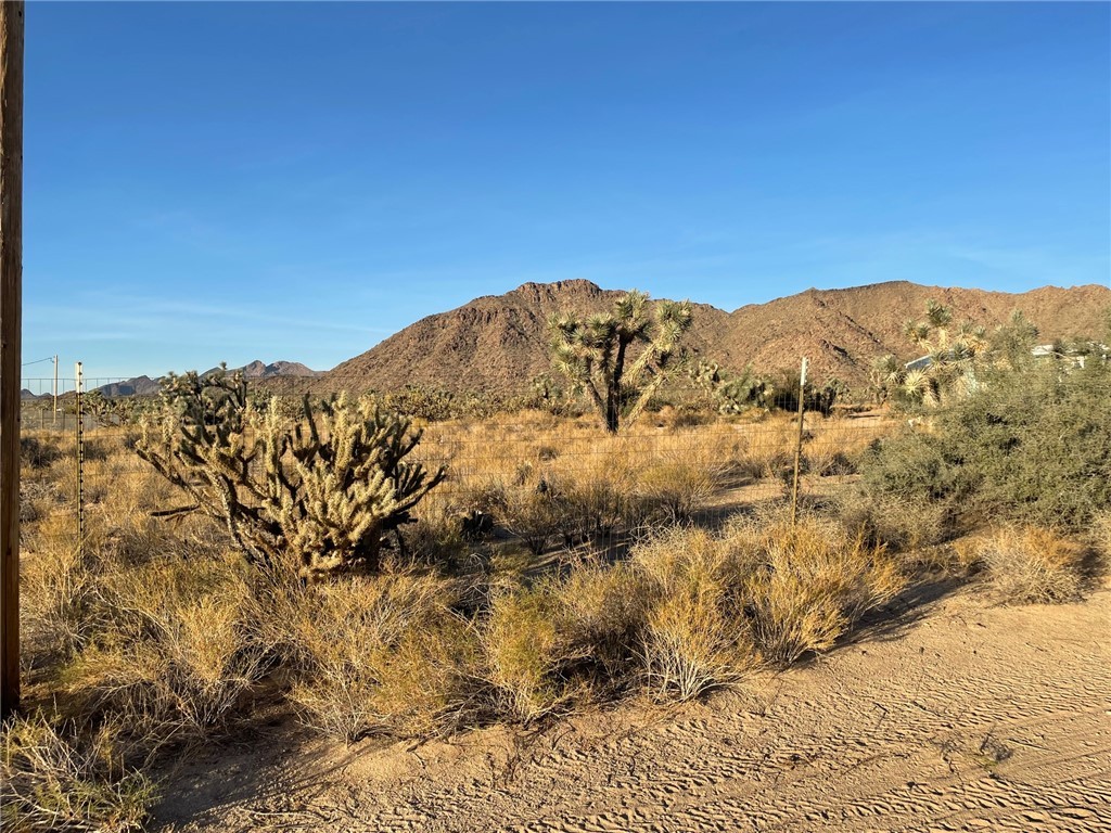 11328 Kinard Road Yucca, AZ 86438 - Photo 35 of 40 a view of a large window with mountains in the background