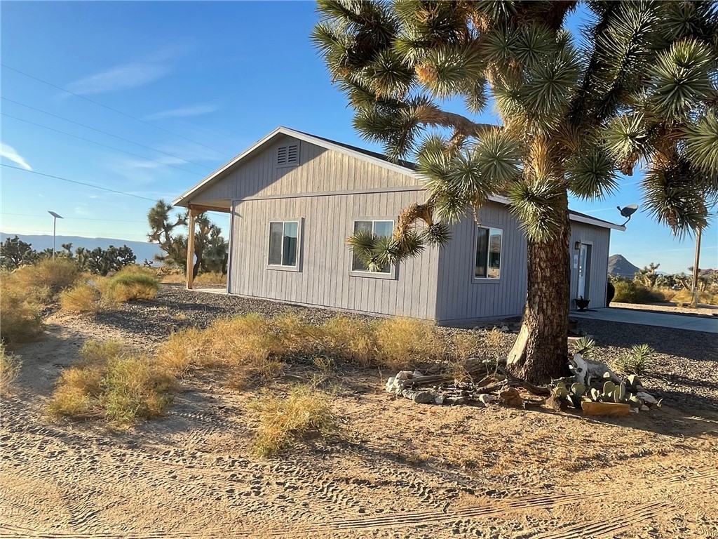 11328 Kinard Road Yucca, AZ 86438 - Photo 4 of 40 a view of a house with a yard