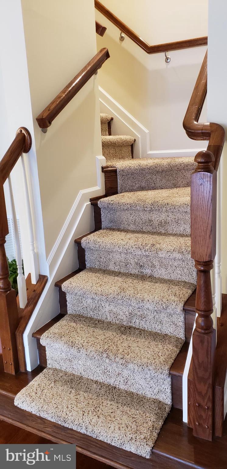 42573 Sunset Ridge Square, Unit 439 Ashburn, VA 20148 - Photo 13 of 41 Living Room Stairs to Master Bedroom