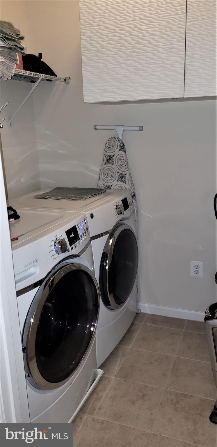 42573 Sunset Ridge Square, Unit 439 Ashburn, VA 20148 - Photo 21 of 41 Master Level Laundry Room w/ Cabinet