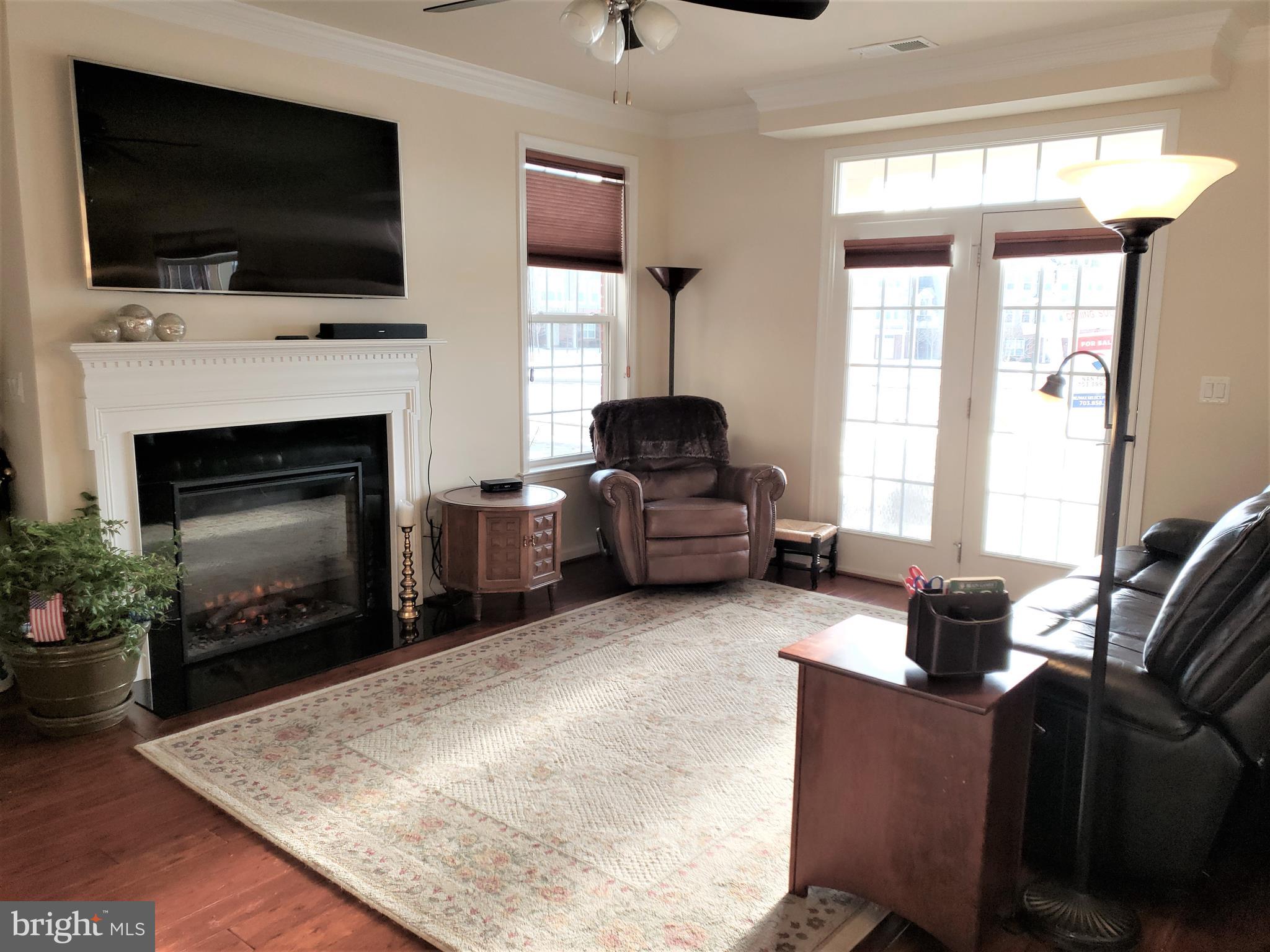 42573 Sunset Ridge Square, Unit 439 Ashburn, VA 20148 - Photo 6 of 41 Living Room view to Covered Patio Doors