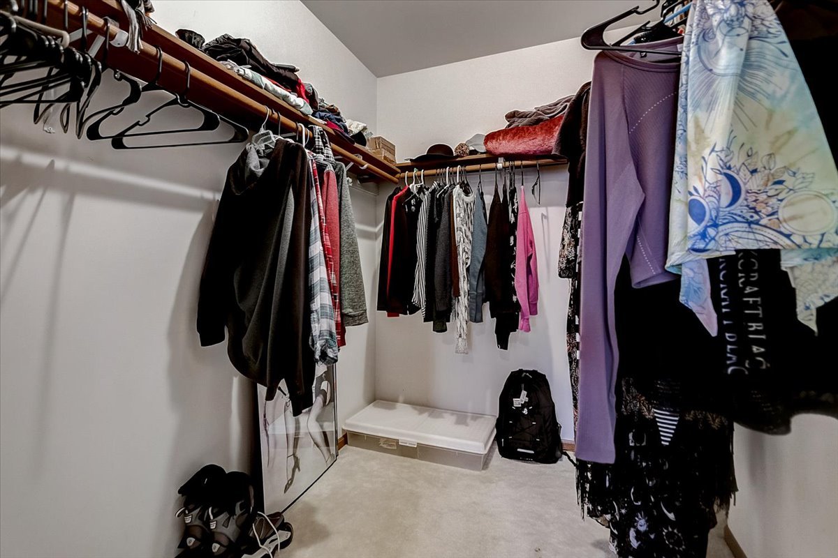 2317 Olde Mill Road Plainfield, IL 60586 - Photo 14 of 35 a view of walk in closet with clothes and shoes