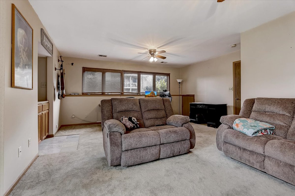 2317 Olde Mill Road Plainfield, IL 60586 - Photo 20 of 35 a living room with furniture and a window