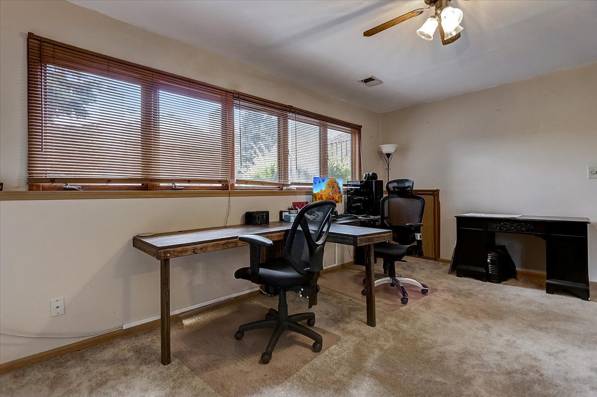2317 Olde Mill Road Plainfield, IL 60586 - Photo 22 of 35 a view of a workspace with furniture and a window
