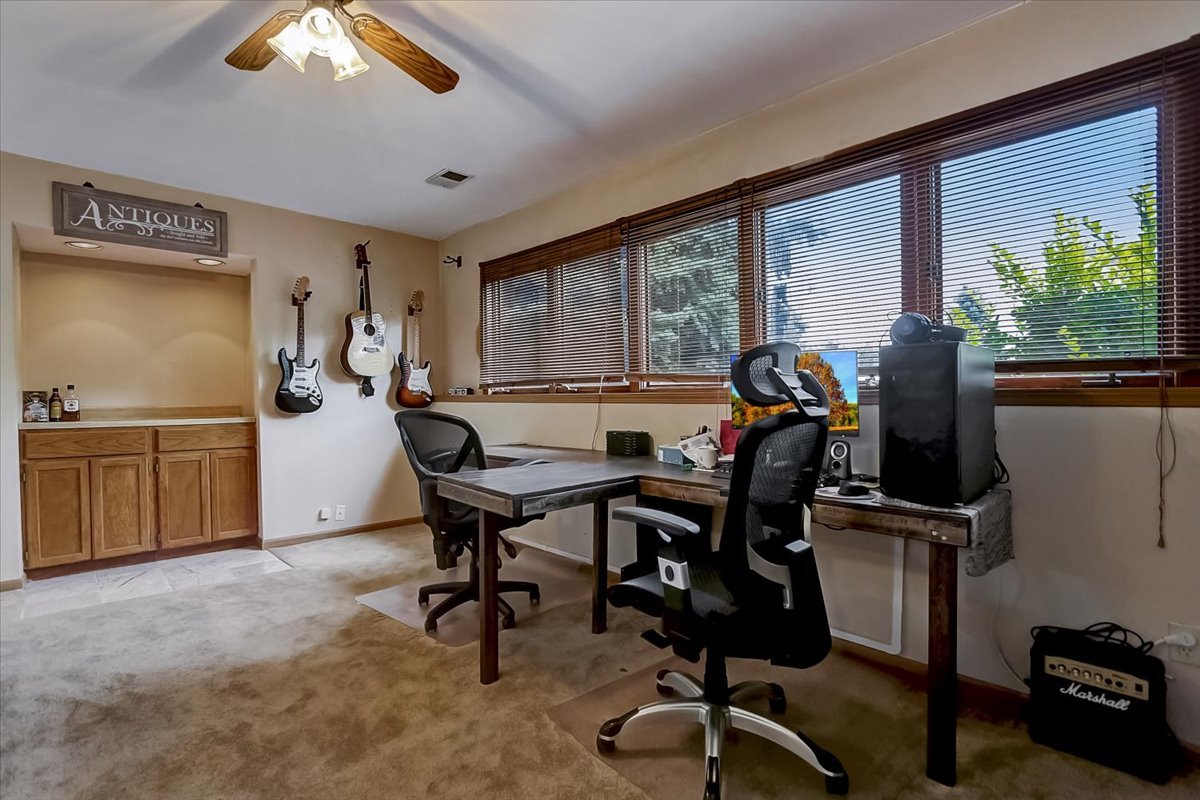 2317 Olde Mill Road Plainfield, IL 60586 - Photo 23 of 35 a view of a workspace with furniture and a window