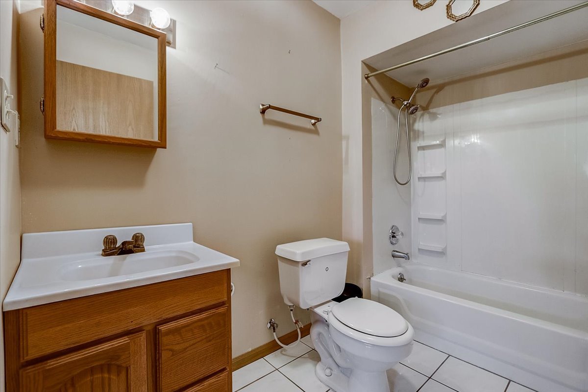 2317 Olde Mill Road Plainfield, IL 60586 - Photo 24 of 35 a bathroom with a sink toilet and shower