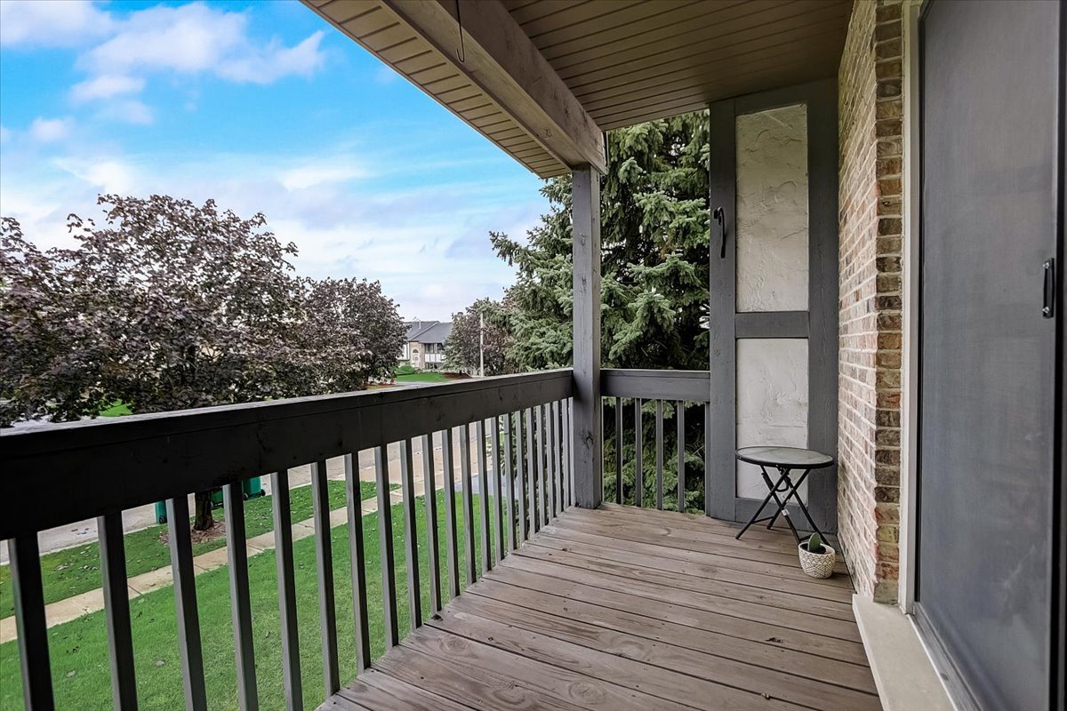 2317 Olde Mill Road Plainfield, IL 60586 - Photo 26 of 35 a view of a balcony with wooden floor