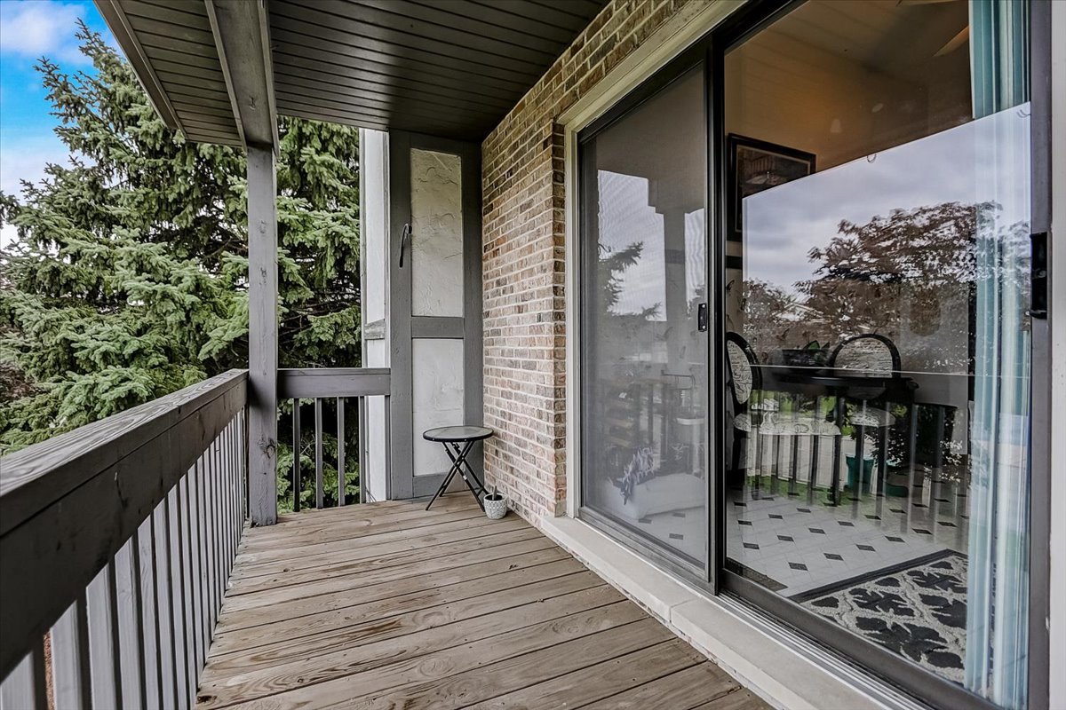 2317 Olde Mill Road Plainfield, IL 60586 - Photo 27 of 35 a view of a balcony with wooden floor