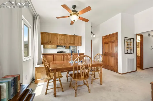 a dining room with furniture and window