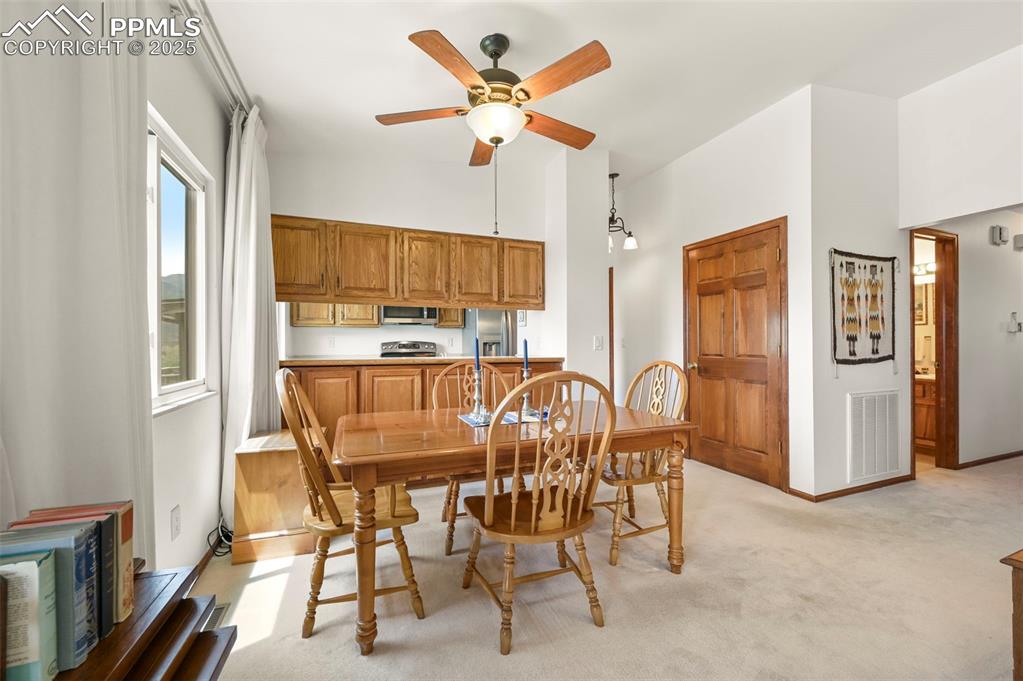 934 Fontmore Road, Unit C Colorado Springs, CO 80904 - Photo 16 of 37 a dining room with furniture and window