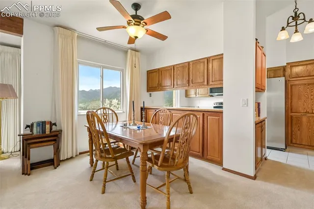 a view of a dining room with furniture window and outside view